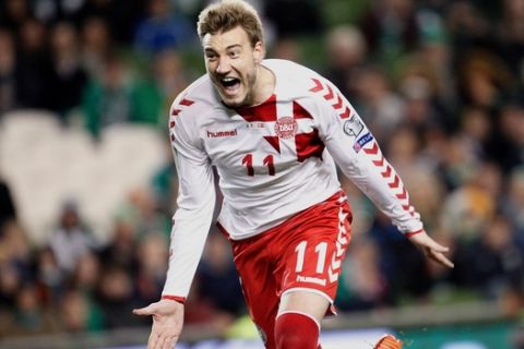 FILE - In this Tuesday, Nov. 14, 2017 filer, Denmark's Nicklas Bendtner celebrates after scoring his side's fifth goal during the World Cup qualifying play off second leg soccer match between Ireland and Denmark at the Aviva Stadium in Dublin, Ireland. (AP Photo/Peter Morrison, File)