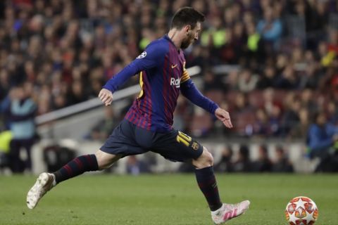 Barcelona's Lionel Messi scores his side's third goal during the Champions League semifinal, first leg, soccer match between FC Barcelona and Liverpool at the Camp Nou stadium in Barcelona, Spain, Wednesday, May 1, 2019. (AP Photo/Emilio Morenatti)