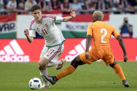 Hungary's Roland Sallai, left, vies for the ball with Tiemoko Konate of the Ivory Coast, during their international friendly soccer match in Groupama Arena in Budapest, Hungary, Friday, May 20, 2016. (Tamas Kovacs/MTI via AP)