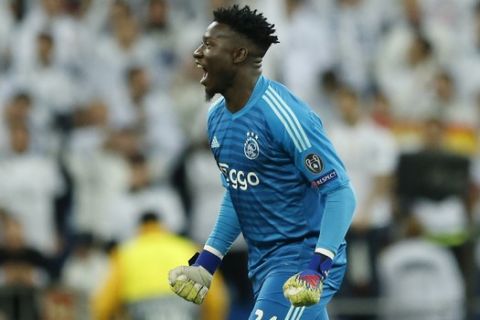Ajax goalkeeper Andre Onana reacts after the opening goal of his team during the Champions League round of 16 second leg soccer match soccer match between Real Madrid and Ajax at the Santiago Bernabeu stadium in Madrid, Tuesday, March 5, 2019. (AP Photo/Bernat Armangue)
