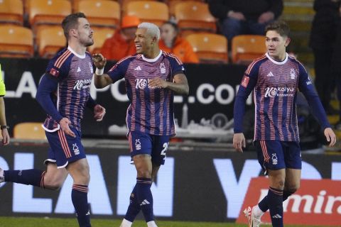 Nottingham Forest's Chris Wood, left, celebrates with his teammates after scoring his side's third goal during the English FA Cup 3rd round replay soccer match between Blackpool and Nottingham Forest at the Bloomfield Road stadium in Blackpool, England, Wednesday, Jan. 17, 2024. (AP Photo/Jon Super)