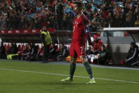 Portugal's Cristiano Ronaldo celebrates after scoring a goal during the World Cup Group B qualifying soccer match between Portugal and Hungary at the Luz stadium in Lisbon Saturday, March 25 2017. (AP Photo/Armando Franca)