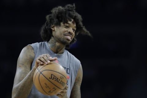 Toronto Raptors center Lucas Nogueira is seen during warmups before the second half of an NBA basketball game against the Detroit Pistons, Wednesday, April 5, 2017, in Auburn Hills, Mich. (AP Photo/Carlos Osorio)