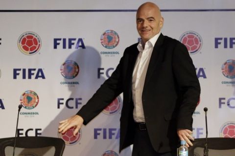 FIFA President Gianni Infantino arrives for a press conference at the Soccer Federation headquarters in Bogota, Colombia, Thursday, March 31, 2016. Infantino is on a two-day official visit to Colombia. (AP Photo/Fernando Vergara)