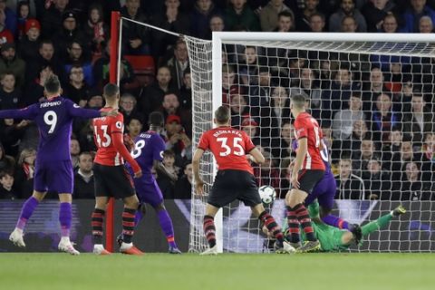Liverpool's Naby Keita, third left, scores his side's opening goal during the English Premier League soccer match between Southampton and Liverpool at St Mary's stadium in Southampton, England Friday, April 5, 2019. (AP Photo/Kirsty Wigglesworth)