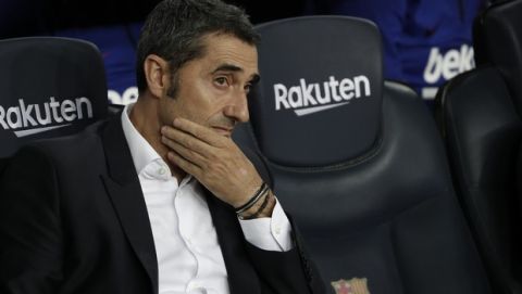 Barcelona's head coach Ernesto Valverde waits for the start of the Spanish La Liga soccer match between FC Barcelona and Villarreal CF at the Camp Nou stadium in Barcelona, Spain, Tuesday, Sep. 24, 2019. (AP Photo/Joan Monfort)