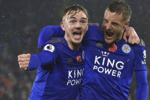 Leicester's James Maddison, left, celebrates with teammate Leicester's Jamie Vardy after scoring his side's second goal during the English Premier League soccer match between Leicester City and Arsenal at the King Power Stadium in Leicester, England, Saturday, Nov. 9, 2019. (AP Photo/Rui Vieira)