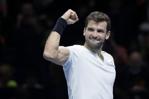 Grigor Dimitrov of Bulgaria celebrates winning match point against Jack Sock of the United States during their ATP World Tour Finals semifinal tennis match at the O2 Arena in London, Saturday Nov. 18, 2017. (AP Photo/Tim Ireland)