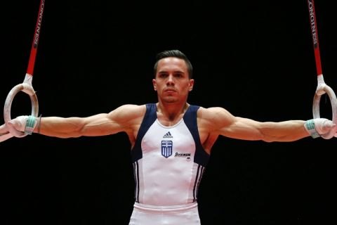 Winner Eleftherios Petrounias of Greece performs his rings exercise during the men's apparatus final competition at the World Artistic Gymnastics championships at the SSE Hydro Arena in Glasgow, Scotland, Saturday, Oct. 31, 2015. (AP Photo/Matthias Schrader)