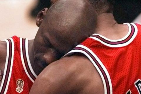 The Chicago Bulls' Michael Jordan collapses in the arms of teammate Scottie Pippen, right, at the end of Game 5 of the NBA Finals against the Utah Jazz Wednesday, June 11, 1997, in Salt Lake City.  Jordan, fighting flu symptoms, scored 38 points as the Bulls beat the Jazz 90-88 to take a 3-2 lead in the series.  (AP Photo/Susan Ragan)