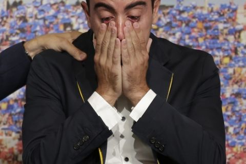 FC Barcelona Xavi Hernandez reacts during  his farewell event at the Camp Nou stadium in Barcelona, Spain, Wednesday, June 3, 2015. FC Barcelona midfielder Xavi Hernandez says he will leave the Catalan club after 17 trophy-laden seasons in which he set club records for appearances and titles won. The 35-year-old Xavi says he will cut his contract short by one year and leave after this season to go play for Qatari club Al-Sadd on a two-year contract. (AP Photo/Manu Fernandez)