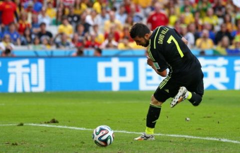 CURITIBA, BRAZIL - JUNE 23: David Villa of Spain scores his team's first goal during the 2014 FIFA World Cup Brazil Group B match between Australia and Spain at Arena da Baixada on June 23, 2014 in Curitiba, Brazil.  (Photo by Jeff Gross/Getty Images)