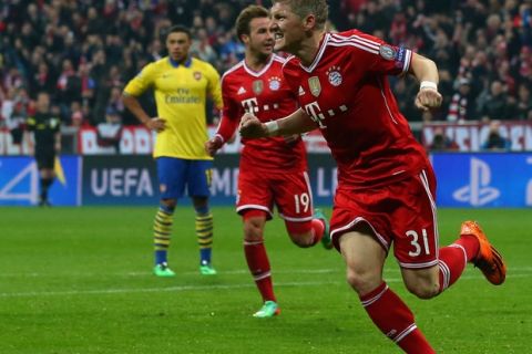 MUNICH, GERMANY - MARCH 11:  Bastian Schweinsteiger of Muenchen celebrates scoring the opening goal during the UEFA Champions League Round of 16 second leg match between FC Bayern Muenchen and Arsenal FC at Allianz Arena on March 11, 2014 in Munich, Germany.  (Photo by Alexander Hassenstein/Bongarts/Getty Images)
