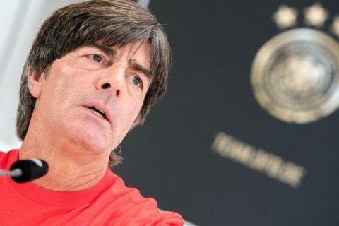 Germany's head coach Joachim Loew speaks at a news conference in Hamburg, Germany, Friday, Oct. 7, 2016. Germany faces the Czech Republic in a soccer World Cup qualifying match on Saturday, Oct. 8, 2016 in Hamburg. (Daniel Bockwoldt/dpa via AP)