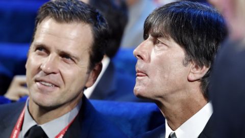 German soccer team coach Joachim Loew, right, and team manager Oliver Bierhoff attend the 2018 soccer World Cup draw in the Kremlin in Moscow, Friday Dec. 1, 2017. (AP Photo/Pavel Golovkin)