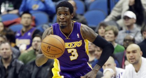 Los Angeles Lakers' Manny Harris drives the ball in an NBA basketball game against the Minnesota Timberwolves, Tuesday, Feb. 4, 2014, in Minneapolis. The Timberwolves won 109-99. (AP Photo/Jim Mone)