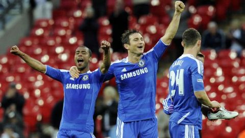 Chelsea's Frank Lampard, center, and team mate Ashley Cole celebrate after beating Tottenham Hotspur in their English FA Cup semifinal soccer match at Wembley Stadium in London, Sunday, April 15, 2012. (AP Photo/Tom Hevezi)