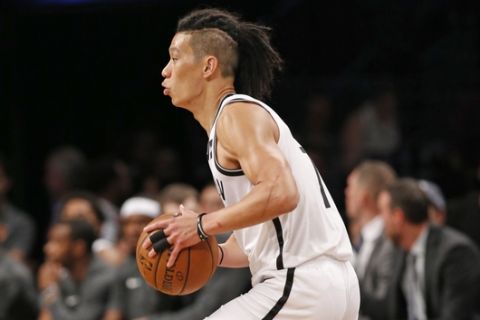 Brooklyn Nets guard Jeremy Lin looks to pass the ball during the first half of the team's preseason NBA basketball game against the Miami Heat, Thursday, Oct. 5, 2017, in New York. (AP Photo/Kathy Willens)
