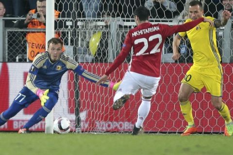Rostov's goalkeeper Nikita Medvedev, left, watches as Manchester United's Henrikh Mkhitaryan scores a goal during the Europa League round of 16 first leg soccer match between Rostov and Manchester United in Rostov-on-Don, Russia, Thursday, March 9, 2017. (AP Photo/Denis Tyrin)