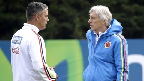 Jose Pekerman, right, coach of Colombia's national soccer team and assistant coach Patricio Camps, talk during a training session in Santiago, Chile, Tuesday June 23, 2015. Colombia will play against Argentina on June 26 in a Copa America quarter finals match. (AP Photo/Jorge Saenz)