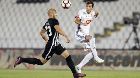Videoton's Marko Scepovic, right, receives a pass as Partizan Belgrade's Nemanja Miletic tries to stop him during their Europa League play off first leg soccer match in Belgrade, Serbia, Thursday, Aug. 17, 2017. (AP Photo/Marko Drobnjakovic)