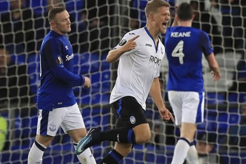 Atalanta's Andreas Cornelius celebrates scoring his side's fourth goal of the game against Everton, during the Europa League group E soccer match between Everton and Atalanta at the Goodison Park stadium in Liverpool, England, Thursday, Nov. 23, 2017. (Peter Byrne/PA via AP)