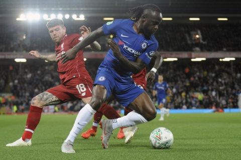 Chelsea's Victor Moses, right, duels for the ball with Liverpool's Alberto Moreno during the English League Cup soccer match between Liverpool and Chelsea at Anfield stadium in Liverpool, England, Wednesday, Sept. 26, 2018. (AP Photo/Rui Vieira)