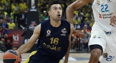 Fenerbahce's Kostas Sloukas dribbles the ball past Real Madrid's Walter Tavares during their Final Four Euroleague final basketball match between Real Madrid and Fenerbahce in Belgrade, Serbia, Sunday, May 20, 2018. (AP Photo/Darko Vojinovic)