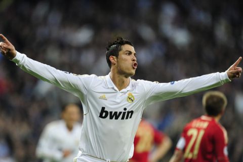 Real Madrid's Portuguese forward Cristiano Ronaldo celebrates after scoring his second goal during the UEFA Champions League second leg semi-final football match Real Madrid against Bayern Munich at the Santiago Bernabeu stadium in Madrid on April 25, 2012.    AFP PHOTO / JAVIER SORIANOJAVIER SORIANO/AFP/GettyImages