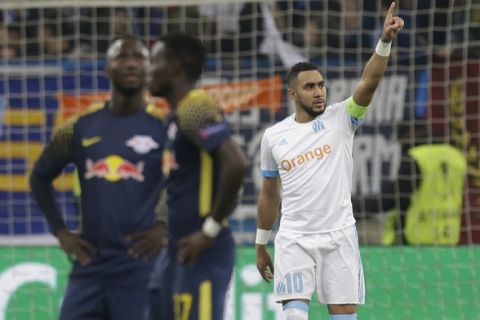 Marseille's Dimitri Payet, right, celebrates scoring his side's 4th goal during the Europa League quarter final second leg soccer match between and Olympique Marseille and RB Leipzig at the Velodrome stadium in Marseille, southern France, Thursday, April 12, 2018. (AP Photo/Claude Paris)