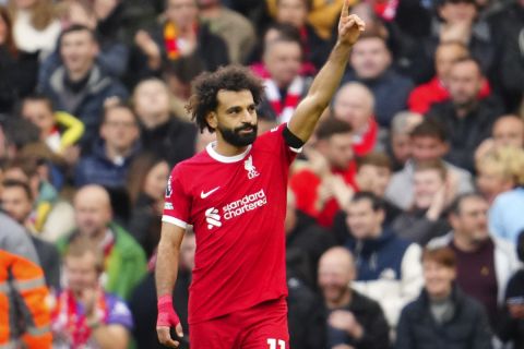 Liverpool's Mohamed Salah celebrates after scoring his side's opening goal during the English Premier League soccer match between Liverpool and Everton, at Anfield in Liverpool, England, Saturday, Oct. 21, 2023. (AP Photo/Jon Super)