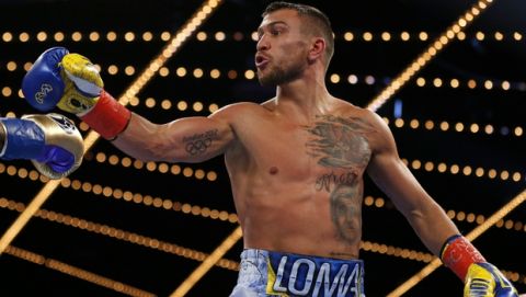 Vasyl Lomachenko, of Ukraine, reacts toward Guillermo Rigondeaux at the end of the second round of a WBO junior lightweight title boxing match Saturday, Dec. 9, 2017, in New York. Lomachenko won the bout. (AP Photo/Adam Hunger)