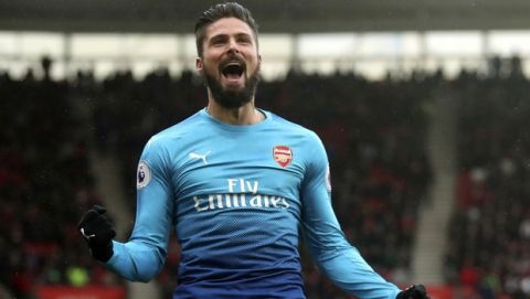 Arsenal's Olivier Giroud celebrates scoring his side's first goal of the game during the English Premier League soccer match against Southampton at St Mary's Stadium, Southampton, England, Sunday Dec. 10, 2017. (Adam Davy/PA via AP)