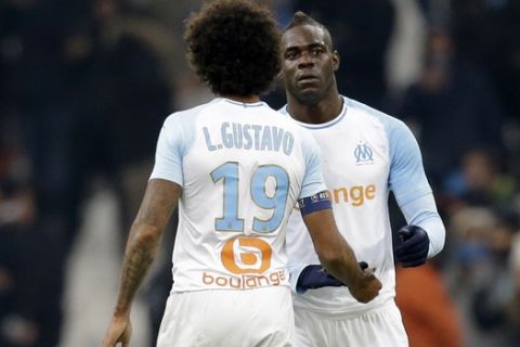 Marseille's Mario Balotelli celebrates after scoring his side's first goal of the game during a French League One soccer match between Olympique Marseille and Lille at the Stade Velodrome in Marseille, France, Friday, Jan. 25, 2019. (AP Photo/Claude Paris)