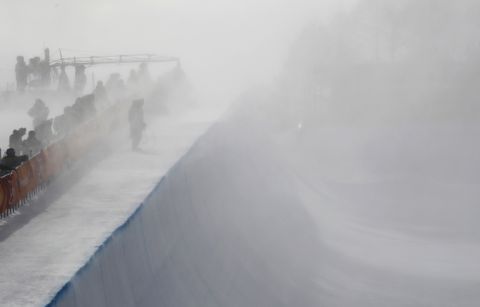 Wind gust engulfs the half pipe course during the women's halfpipe qualifying at Phoenix Snow Park at the 2018 Winter Olympics in Pyeongchang, South Korea, Monday, Feb. 12, 2018. (AP Photo/Gregory Bull)