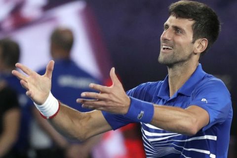 Serbia's Novak Djokovic celebrates after defeating Spain's Rafael Nadal in the men's singles final at the Australian Open tennis championships in Melbourne, Australia, Sunday, Jan. 27, 2019. (AP Photo/Kin Cheung)