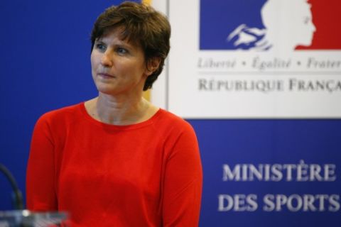 Newly appointed French Sports Minister Roxana Maracineanu stands prior to deliver a speech during the handover ceremony at the Sports Ministry, in Paris, Tuesday, Sept. 4, 2018. French President Emmanuel Macron has picked a political ally and a former swimming world champion to plug two holes in his government left by the unexpected departures of the ministers for the environment and for sport. (AP Photo/Thibault Camus)