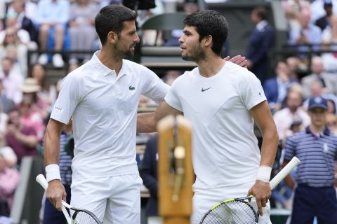 Serbia???s Novak Djokovic, left, and Spain's Carlos Alcaraz pose for a photo ahead of the final of the men???s singles on day fourteen of the Wimbledon tennis championships in London, Sunday, July 16, 2023. (AP Photo/Kirsty Wigglesworth)