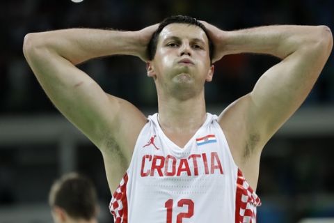 Croatia's Darko Planinic (12) reacts at the end of a quarterfinal round basketball game against Serbia at the 2016 Summer Olympics in Rio de Janeiro, Brazil, Wednesday, Aug. 17, 2016. (AP Photo/Charlie Neibergall)