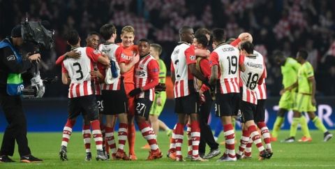PSV Eindhoven's players celebrate after winning the UEFA Champions League, Group B, football match PSV Eindhoven vs FK CSKA Moscow at the Philips Stadion stadium in Eindhoven on December 8, 2015. PSV won the match 2-1.  AFP PHOTO / JOHN THYS / AFP / JOHN THYS        (Photo credit should read JOHN THYS/AFP/Getty Images)