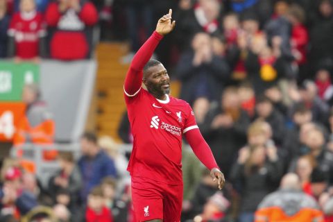Liverpool Legends' Djibril Cisse celebrates scoring his sides second goal during an exhibition soccer match between Liverpool Legends and Ajax Legends at Anfield Stadium, Liverpool, England, Saturday March 23, 2024. (AP Photo/Jon Super)