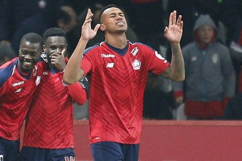 Lille's Gabriel, center, celebrates a goal during the French League One soccer match between OSC Lille and Paris-Saint-Germain at Stade Pierre Mauroy in Lille, France, Sunday, April 14, 2019.(AP Photo/Michel Spingler)