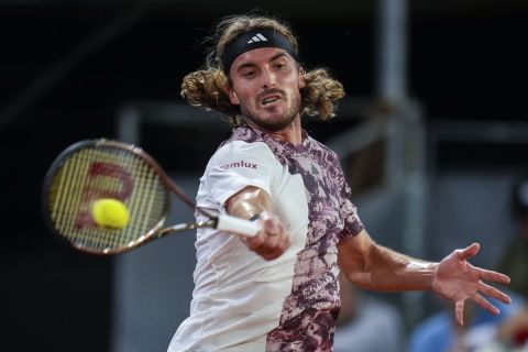 Greece's Stefanos Tsitsipas returns the ball against Bernabe Zapata Miralles, of Spain, during their match at the Madrid Open tennis tournament in Madrid, Spain, Tuesday, May 2, 2023. (AP Photo/Manu Fernandez)