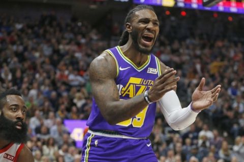 Utah Jazz forward Jae Crowder (99) reacts after being called with for foul, as Houston Rockets guard James Harden, left, watches during the first half of an NBA basketball game Thursday Dec. 6, 2018, in Salt Lake City. (AP Photo/Rick Bowmer)