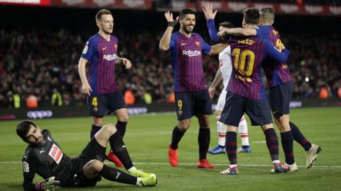 FC Barcelona's Lionel Messi, second right, celebrates after scoring his side's second goal during the Spanish La Liga soccer match between FC Barcelona and Eibar at the Camp Nou stadium in Barcelona, Spain, Sunday, Jan. 13, 2019. (AP Photo/Manu Fernandez)