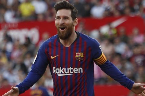 Barcelona forward Lionel Messi celebrates after scoring his side's second goal during La Liga soccer match between Sevilla and Barcelona at the Ramon Sanchez Pizjuan stadium in Seville, Spain. Saturday, February 23, 2019. (AP Photo/Miguel Morenatti)