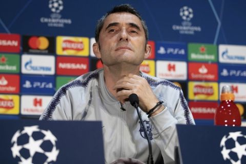 Barcelona manager Ernesto Valverde gestures, during a press conference at Old Trafford, in Manchester, England, Tuesday, April 9, 2019.  Barcelona will play Manchester United in a Champions League quarter final soccer match on Wednesday.  (Ian Hodgson/PA via AP)