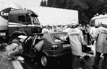 Germany: Firemen stand next to the wrecked car of Croatian basketball player Drazen Petrovic, who was killed late 07 June when his car crashed into a truck on Germany's A9 motorway. Petrovic was one of the top scorers in the U.S. NBA basketball championships.   (B/W) (Photo credit should read -/AFP/Getty Images)