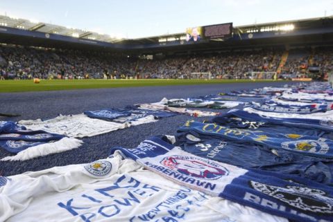 Tributes from other football clubs and fans surround the pitch ahead of the Premier League match at the King Power Stadium, Leicester. Saturday Nov. 10, 2018. (Joe Giddens/PA via AP)