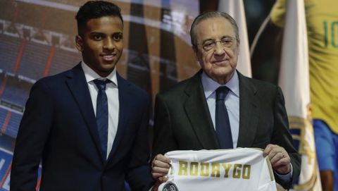Brazilian player Rodrygo Goes, left, poses with Real Madrid President Florentino Perez during his official presentation after signing for Real Madrid at the Santiago Bernabeu stadium in Madrid, Spain, Tuesday, June 18, 2019. (AP Photo/Manu Fernandez)